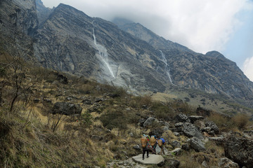 Fototapeta na wymiar Amazing waterfall falling from the rocky peaks n
