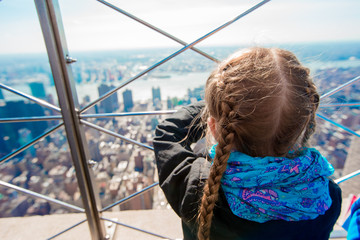 Little girl enjoy view to New York City from Empire State Building