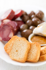 toasts with smoked sausages, pate and olives
