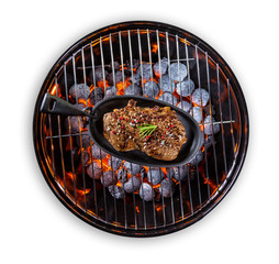 Beef steak in pan served on grill