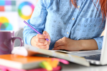 Female student or designer making sketches