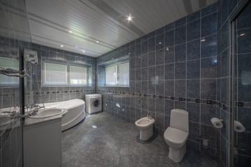 Toilet and bathroom in a modern home.