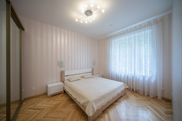 Fototapeta na wymiar Bedroom in a modern house.