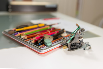 Fototapeta premium Master tattoo artist prepares the transfer tattoo sketch