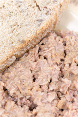 Canned tuna with bread served on a plate
