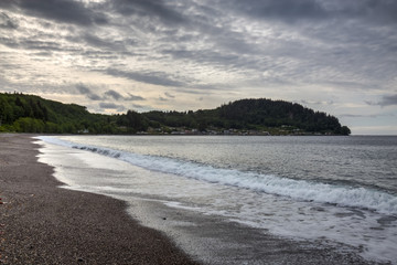 View of Sekiu, Washington, from the beach along the Straith of Juan de Fuca Highway, on a cloudy morning.