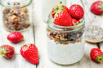 Chia seeds granola Greek yoghurt pudding with strawberries