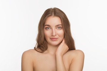 Studio shot of happy beautiful shirtless lady looking at camera and posing for photograher over white background.