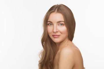 Portrait of happy woman with brown hair looking at camera. Beautiful shirtless lady posing for photographer over white background.