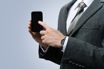 businessman in a suit with gadget