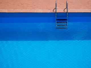 Minimalistic swimming pool with steps - holiday, vacation background etc.