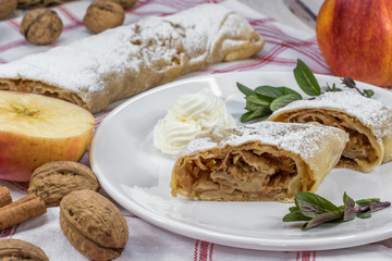 Detail on a Two Slices Homemade Apple Strudel on a Plate with Wh