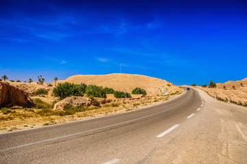 Fototapeta na wymiar Road in Sahara desert, Tunisia, Africa