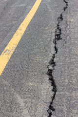 Asphalt broken yellow line.