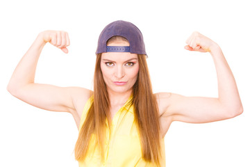 Woman casual style showing off muscles biceps