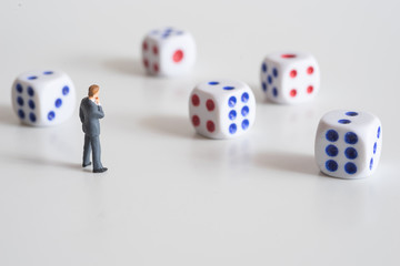 Businessman thinking with dice.