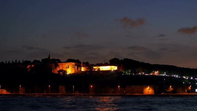 topkapi palace illuminated at night as seen from bosphorus sea istanbul skyline cityscape riverfront