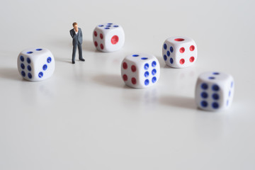 Businessman thinking with dice.