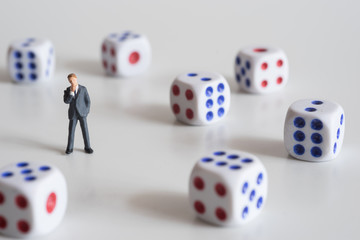 Businessman thinking with dice.