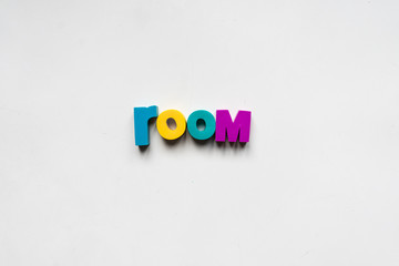 Making the word "room" using colorful letters.