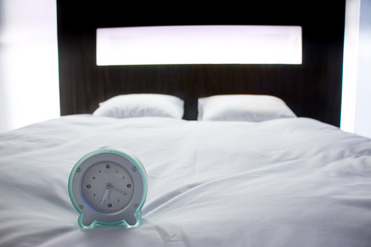 Alram Clock on Double bed, modern bedroom