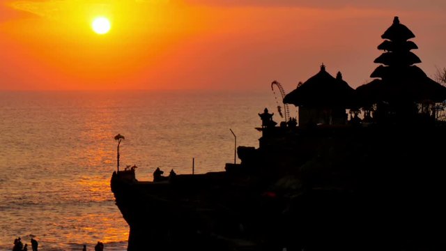 hindu sea temple tanah lot bali indonesia at the sunset sun reflecting on the ocean