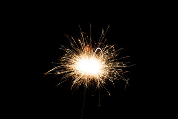 Sparkler on black background, close-up