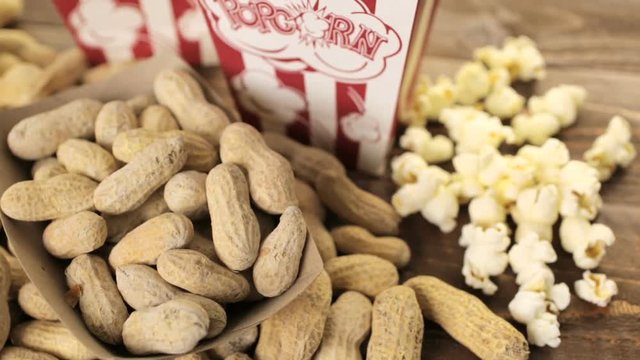Game day traditional snacks included corndogs and salted peanuts on a wood board
