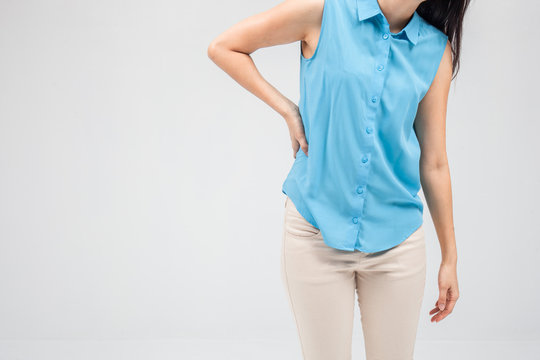 Business woman with back pain holding her aching hip