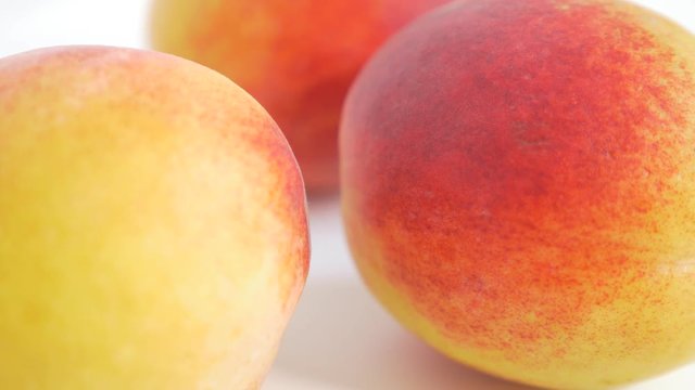 Peaches on white juicy fruit close-up UHD 4K 2160p footage - Peach on white background 3840X2160 UHD fruit video