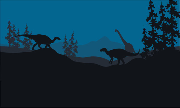 Silhouette of Brachiosaurus and Iguanodon in hills
