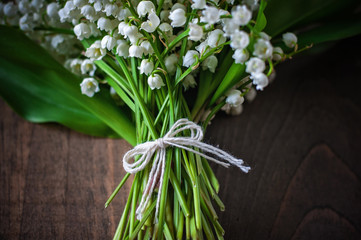 Bouquet of Lily of the valley flowers, selective focus, toned image