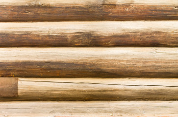 Fototapeta premium wall of masonry round log