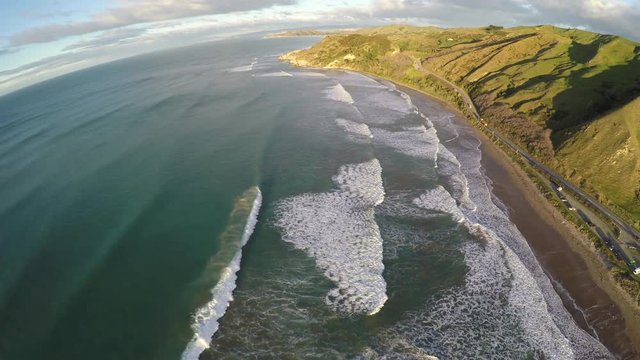 Aerial View Of Scenic Coastal Highway And Surfing Waves In Gisborne, New Zealand