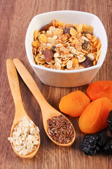 Linseed, rye flakes, dried fruits and muesli, concept of healthy nutrition and increase metabolism