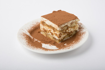 Tiramisu cake on white plate