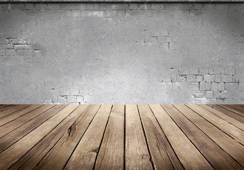 Wood plank table with concrete wall background