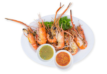 Grilled shrimps on a plate served with spicy sauce