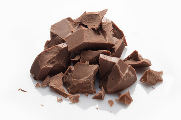 Pieces of milk chocolate isolated on white