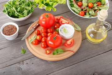 set of tomato with green salad leaves