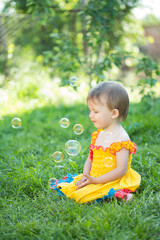 Baby girl with soap bubbles