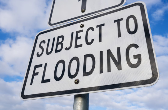 Close-up view of a flooding sign