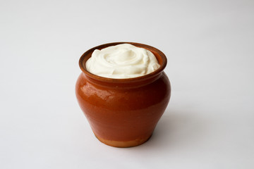 Obraz na płótnie Canvas sour cream in a pot