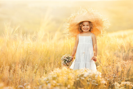 Little girl with a bouquet of wild flowers