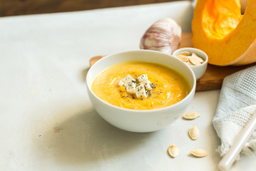 pumpkin soup with cheese and herbs