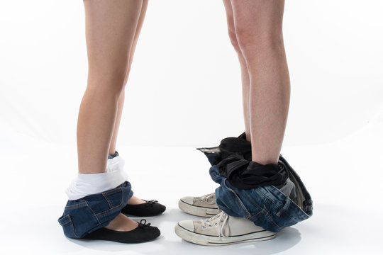 Profile of Legs of loving couple. Man and woman who undresses