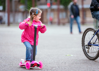 Girl riding scooter