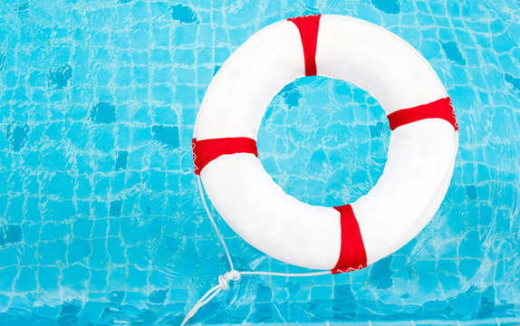 Life Ring at the swimming pool. Life Ring on water. Life Ring on