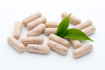 Ginkgo biloba capsule on the white background.