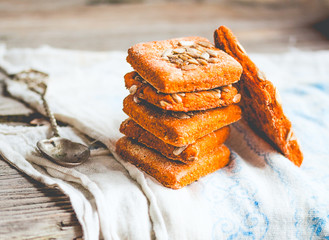 Lenten cookies on the basis of tomato juice, seeds,rustic wood b
